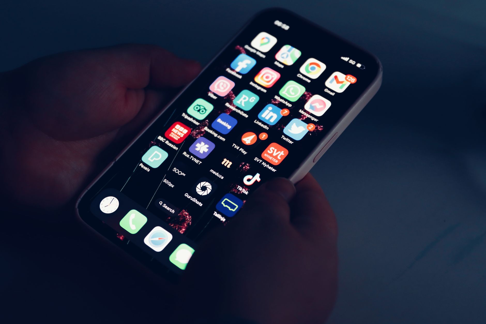 hands holding a smartphone with the app store download screen visible