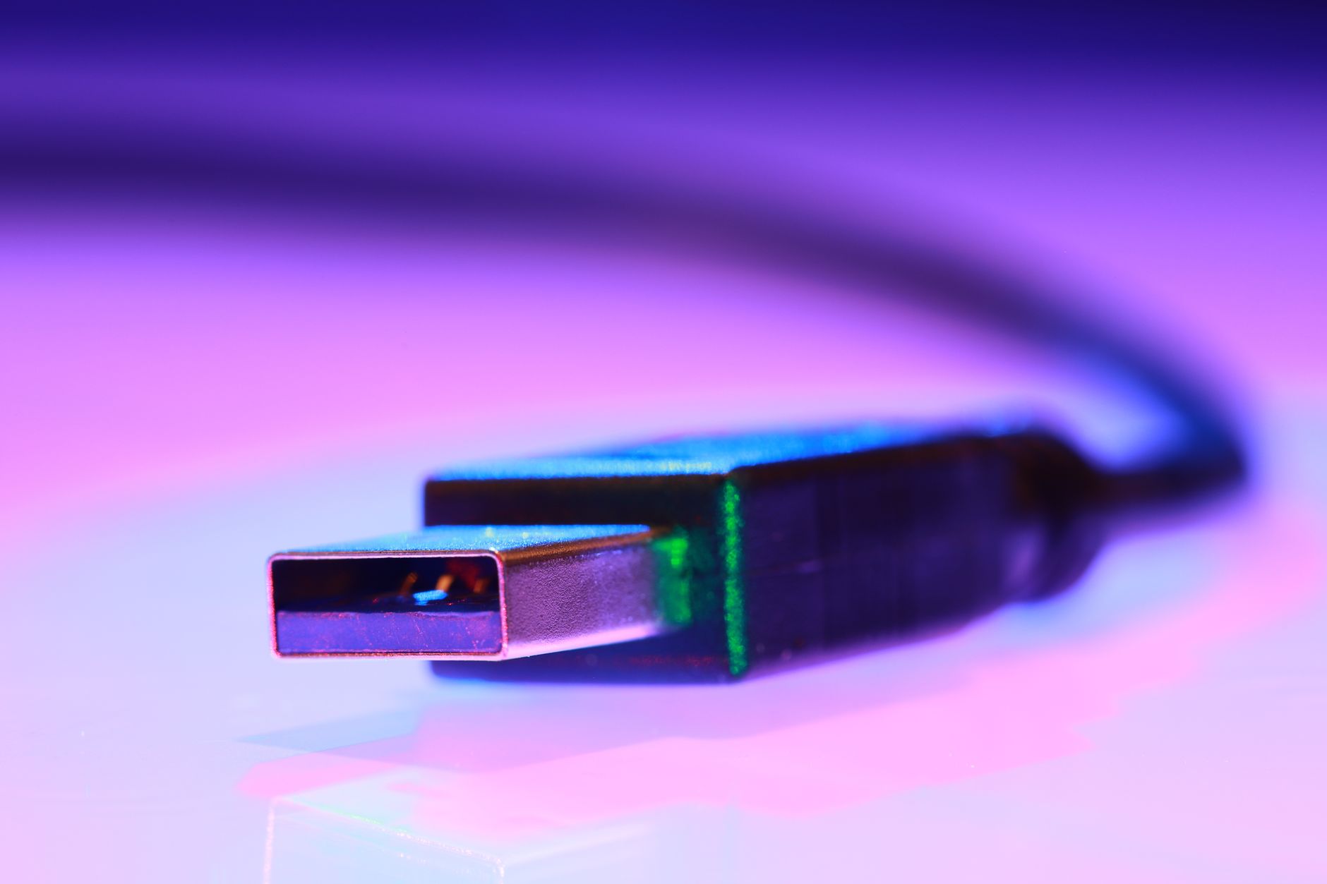 Android phone connected to a laptop with a USB cable showing developer options on the screen