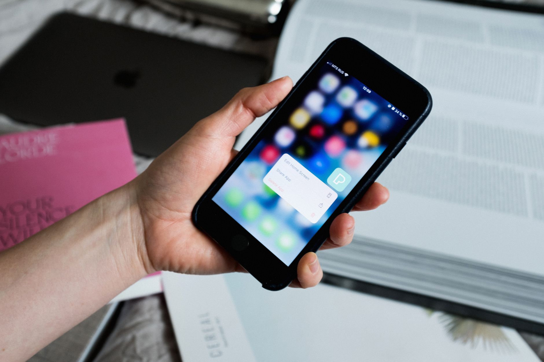 a smartphone screen showing a password manager app with a list of saved logins and lock icons